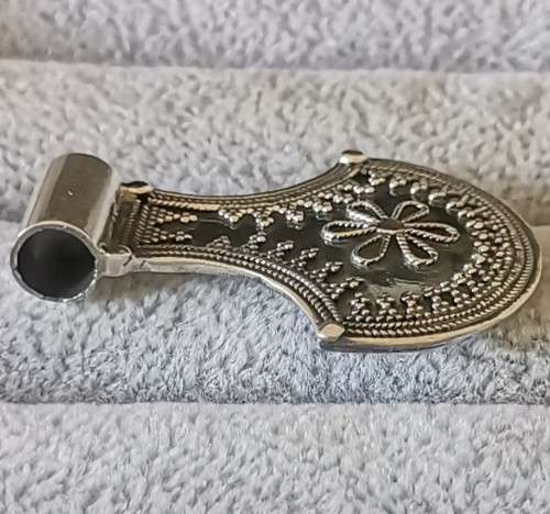 Silver pendant with intricate detailing
