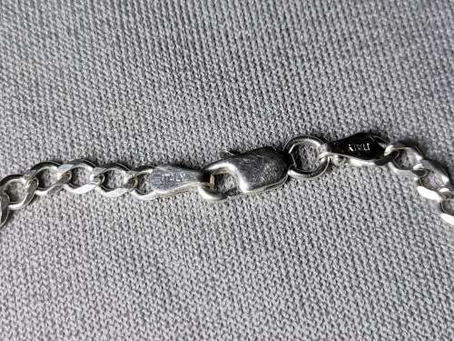 **R1 Auction**  Silver Curb Bracelet