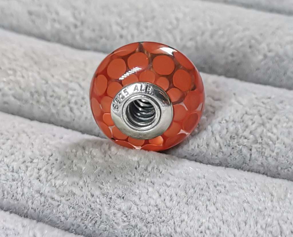 **R1 Auction**  Pandora Large Burnt Orange Dots Glass Charm