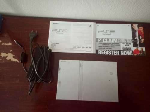 Old PS2 console with cable, manual and 9 games(not tested)