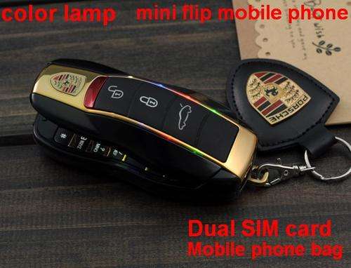 MUST HAVE!!!NEW PORSCHE MINI KEY FLIP CELLPHONE FM SD SLOT BLUETOOTH CAMERA VIDEO GPRS....1st on bid