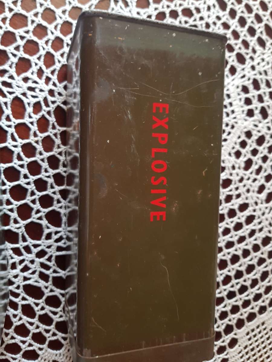 ARMY HELMET AND EXPLOSIVE CANISTERS