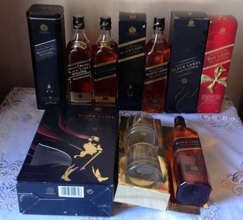 21 BOTTLES OF ASSORTED WHISKEY UP FOR GRABS . SEE PICTURES AND DESCRIPTION.