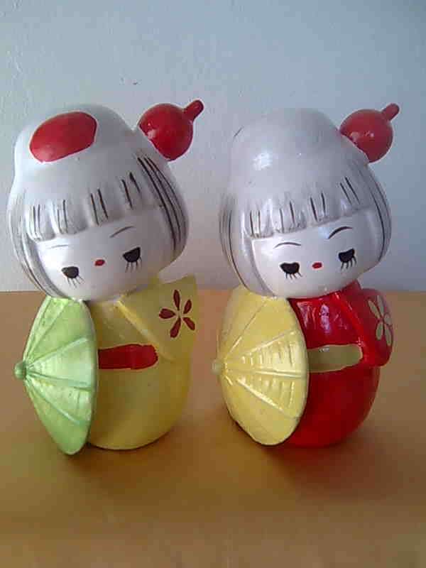 A PAIR OF GEISHA MONEY BOXES