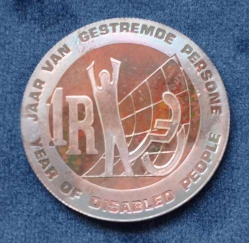 R1 SILVER PROOF COIN - (YOD) THE YEAR OF DISABLED - IN SAM BOX - WELL TONED