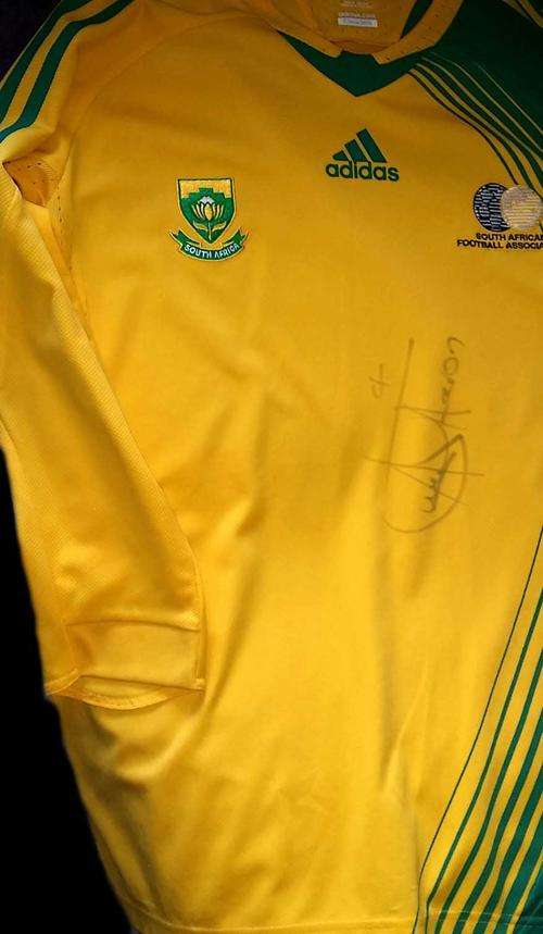 2010 world cup soccer jersey signed by aaron mokoena - collectors item