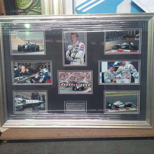Mclaren F1 Montage signed by Kimi Raikkonen and David Coulthard .