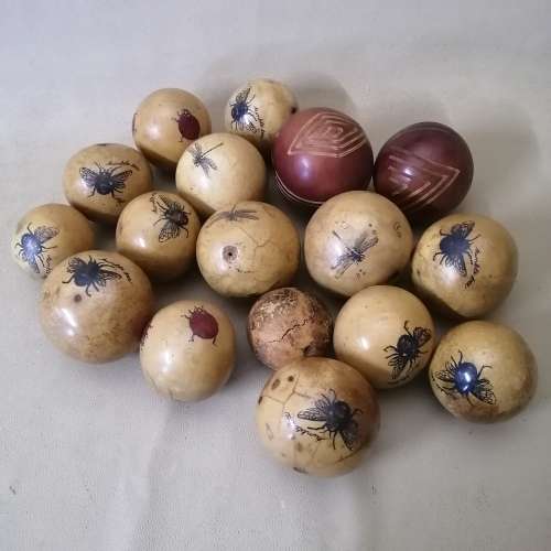Large Collection Of Wooden Balls Decorated With Hand Drawn Insects