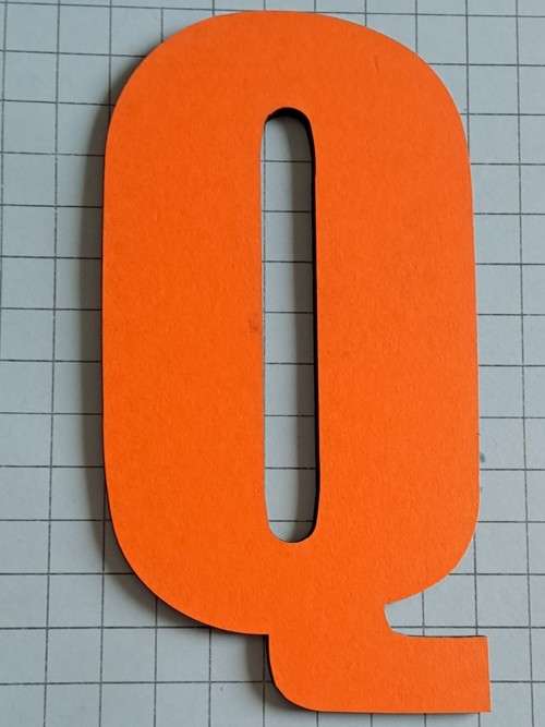 Wooden orange `Q`