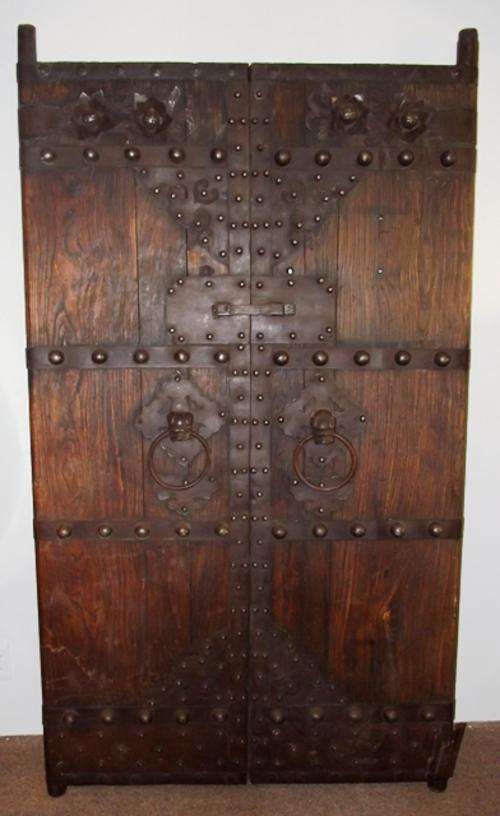 IMPORTED DOUBLE DOORS WITH METAL TRIMMINGS