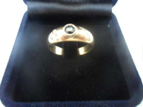 Magnificent 9ct Gold Ring Set With A Blue Sapphire And Diamonds  .