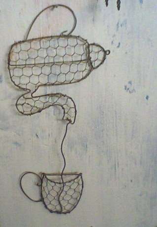 Lovely handcrafted coffee pot and cup decoration for the kitchen.