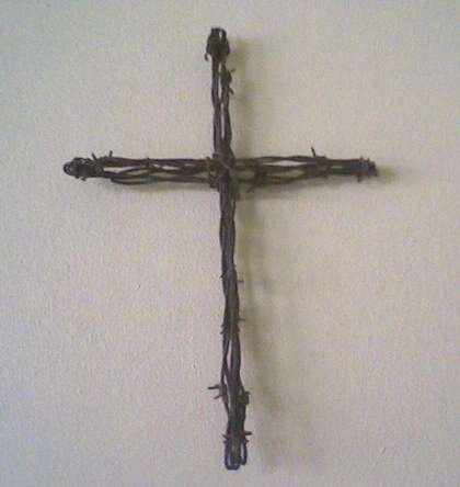 Rustic barbwire cross - lovely!