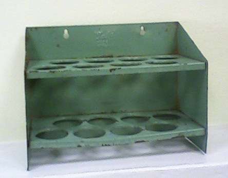 Antique tin egg or herb holder from England .