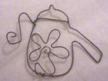 Mini rustic wire charm for scrapbooking or cardmaking .