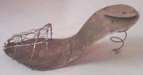 Cheeky high heel tin shoe with wire detail.