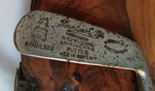 Antigue Tornton Appoaching Putter mounted on Rare South Aftican Hard Wood.