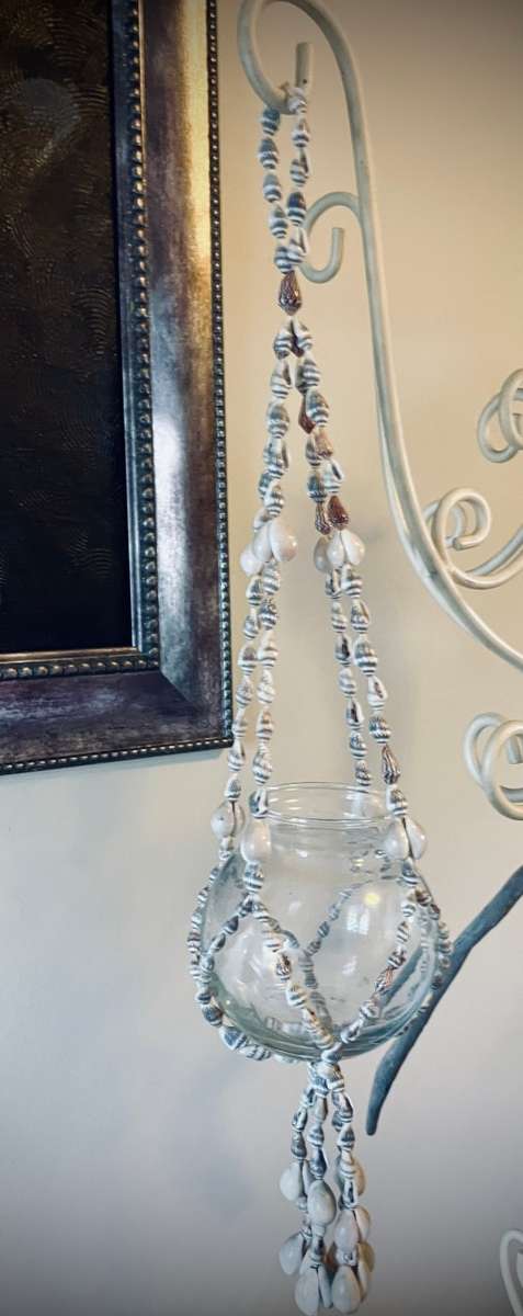 Macramé sea shell plant hanger or I used ot as a candle holder