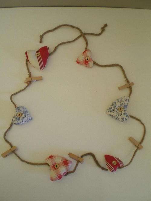 String of hearts on rope with pegs