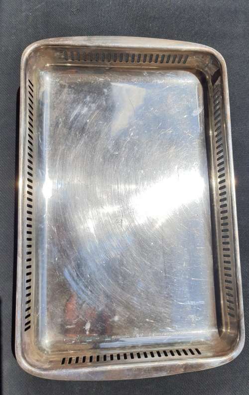 AN ANTIQUE SILVER PLATED SERVING TRAY STAMPED SP ON K