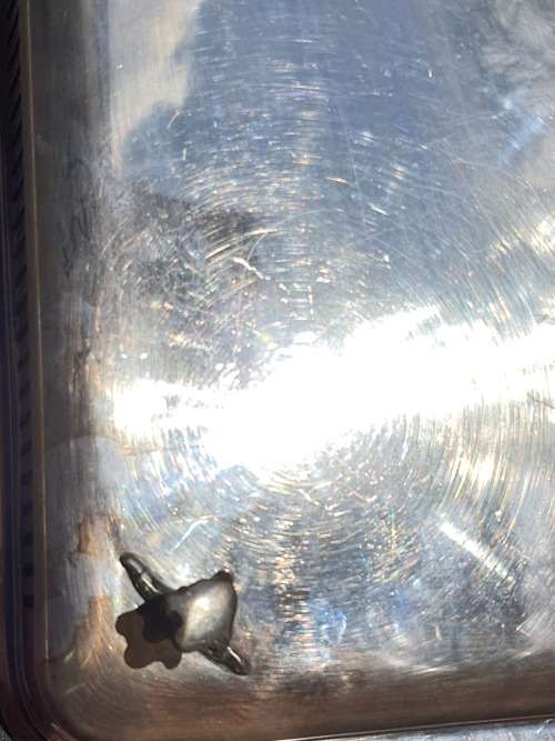 AN ANTIQUE SILVER PLATED SERVING TRAY STAMPED SP ON K