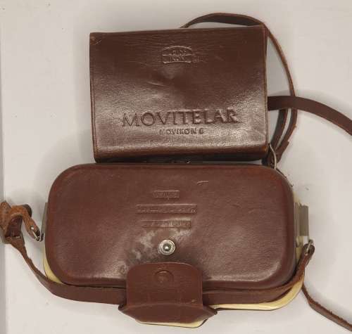 AN ANTIQUE MOVIE CAMERA  A ZEIS IKON MOVIENETTE COMPLETE WITH ATTACTMENTS