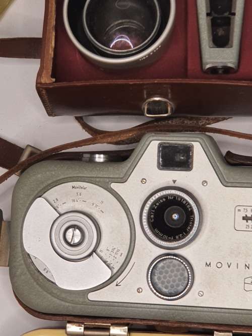 AN ANTIQUE MOVIE CAMERA  A ZEIS IKON MOVIENETTE COMPLETE WITH ATTACTMENTS