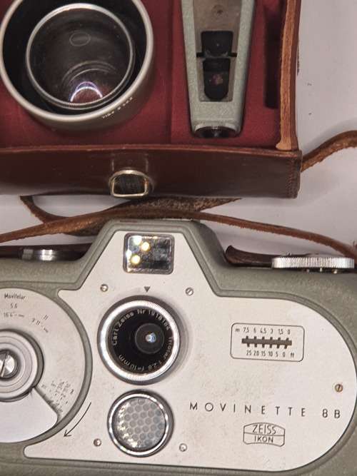 AN ANTIQUE MOVIE CAMERA  A ZEIS IKON MOVIENETTE COMPLETE WITH ATTACTMENTS