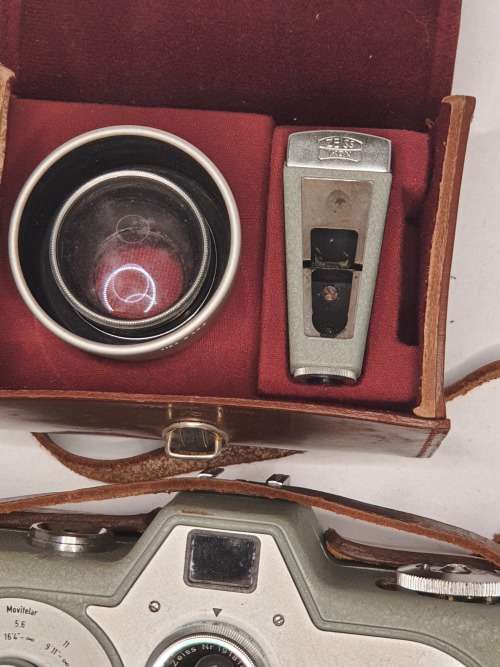 AN ANTIQUE MOVIE CAMERA  A ZEIS IKON MOVIENETTE COMPLETE WITH ATTACTMENTS