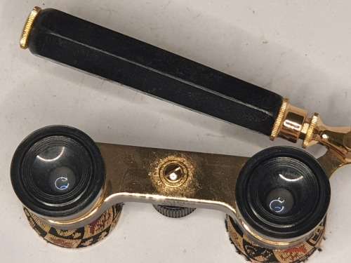 A VINTAGE LADIES OPERA BINOCULARS WITH FANCY TAPESTRY DESIGN BOTH THE BINOCULARS AND THE CASE SOLD A