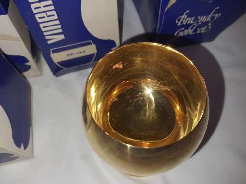 A VINTAGE SET OF 4 GOLD AND SILVER PLATED BRANDY GOBLETS SOLD AS IS