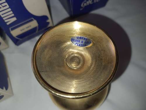 A VINTAGE SET OF 4 GOLD AND SILVER PLATED BRANDY GOBLETS SOLD AS IS