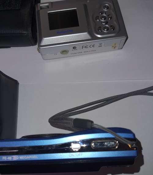 TWO VINTAGE POCKET DIGITAL CAMERAS WORKING SOLD AS IS