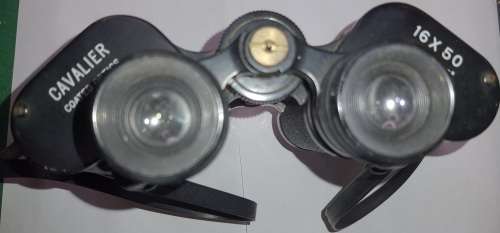 A VINTAGE BINOCULARS SOLD AS IS