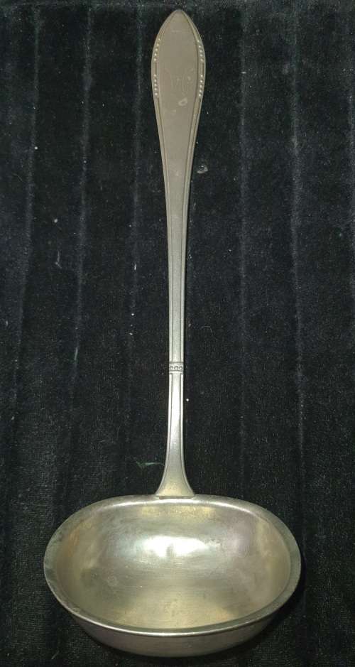 A VINTAGE METAL  SOUP LADEL FOR CATERERS OR COLLECTORS SOLD AS IS