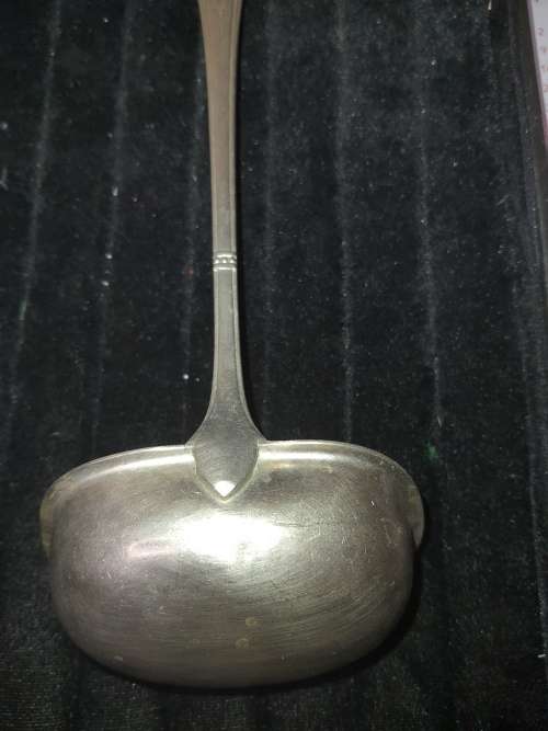 A VINTAGE METAL  SOUP LADEL FOR CATERERS OR COLLECTORS SOLD AS IS