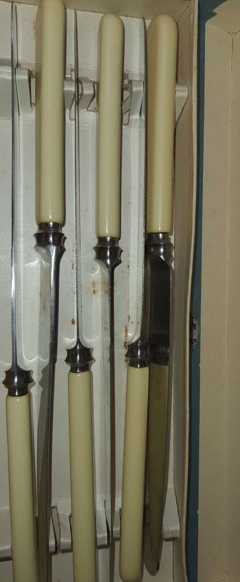 A SET OF SIX BONE HANDLED STEAK KNIVES STAINLESS  STEEL BY TRUSTWELL BROTHERS SHEFFIELD ENGLAND