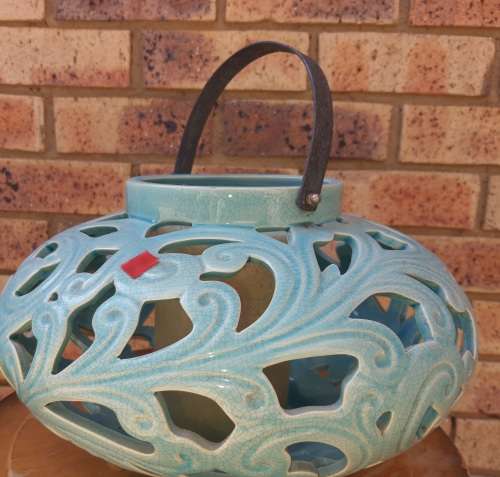 AN EXCEPTIONAL SET CERAMIC ORNATELY DESIGNED TURQUOIS COLOURED CANDLE HOLDERS