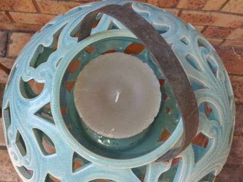AN EXCEPTIONAL SET CERAMIC ORNATELY DESIGNED TURQUOIS COLOURED CANDLE HOLDERS