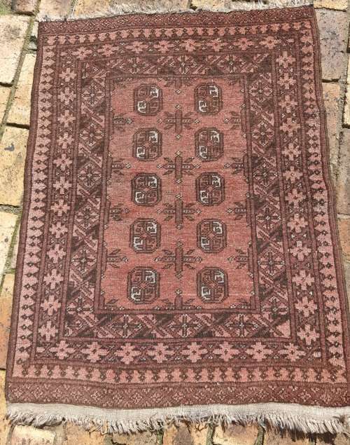 A VINTAGE PERSIAN CARPET USED DIAMENSIONS 42X32 INCHES APPROXIMATELY, IT IS A FAIRLY GOOD CONDITION