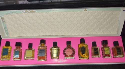 A FRENCH MINITURE PERFUME SET SOLD AS IS