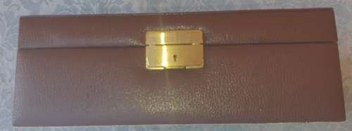 A NEAT BROWN LEATHER COVERED JEWELRY BOX IN GOOD CONDITON SOLD AS IS