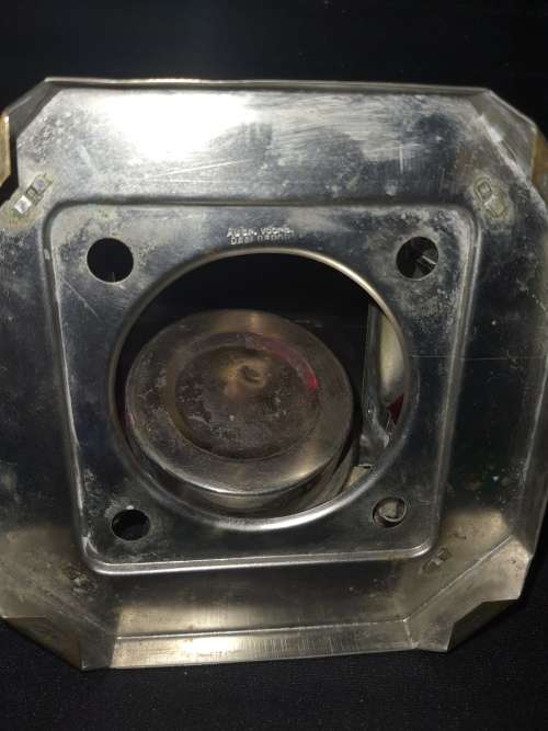 AN ANTIQUE  STAINLESS STEEL LANTETRN WITH A RED GLASS INSERT SOLD AS IS