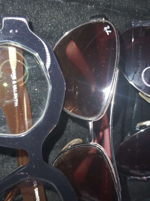 A COLLECTION OF QUALITY BRANDED SUNGLASSES SOLD AS IS