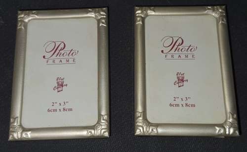 TWO VIRTUALLY BRAND-NEW SMALL PICTURE FRAMES SOLD AS IS