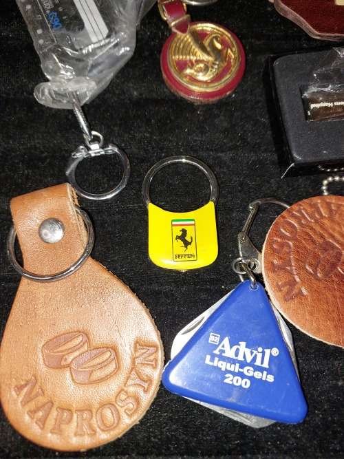 A VINTAGE JOBLOT KEY RINGS SOLD AS IS