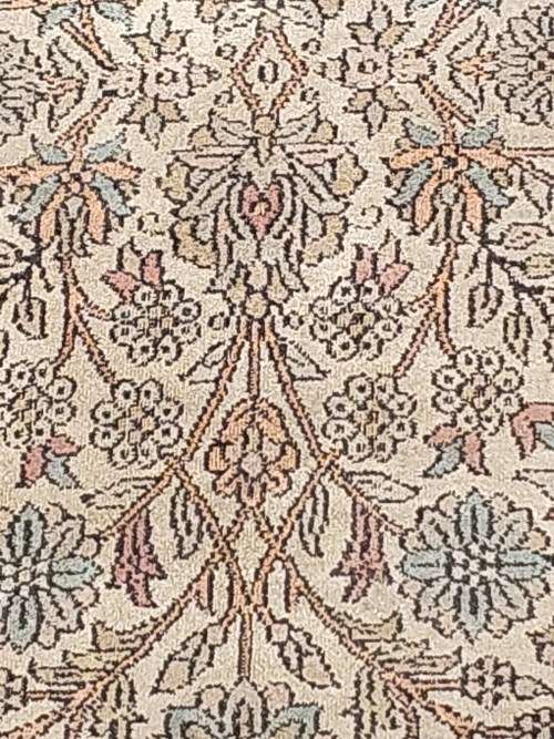 AN ARABIC PERSIAN STYLE CARPET TURQUOIS AND OTHER COLOURS