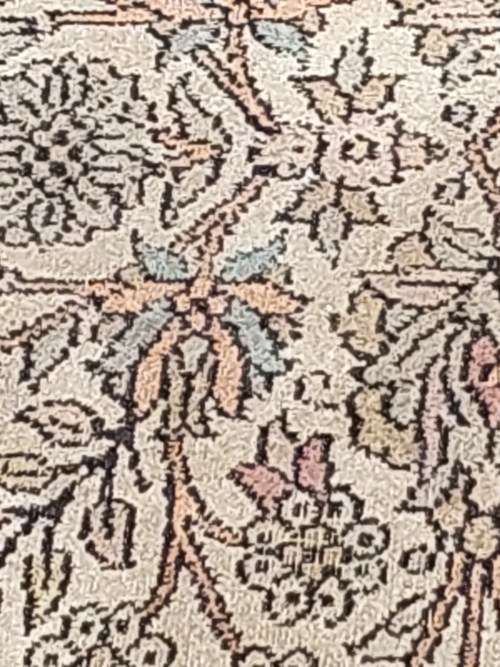 AN ARABIC PERSIAN STYLE CARPET TURQUOIS AND OTHER COLOURS