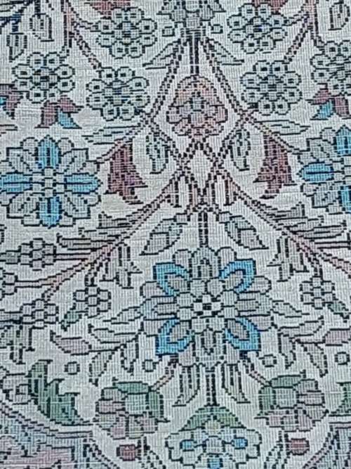 AN ARABIC PERSIAN STYLE CARPET TURQUOIS AND OTHER COLOURS