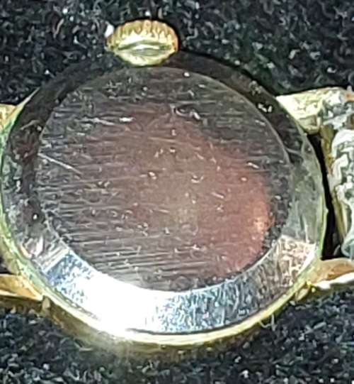 AN ANTIQUE OMEGA WOMANS WATCH SOLD AS IS NOT TESTED